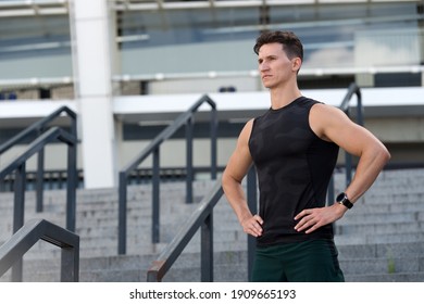 Mind And Body In Harmony. Healthy Lifestyle. Countdown Timer. Urban Runner Man With Sports Watch. Sport Equipment In Use Outdoors On Summer Trail. Athletic Guy Wearing Smart Watch.