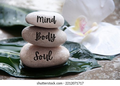Mind, Body and Soul words engraved on zen stones with space for text. Zen concept. - Shutterstock ID 2212071717