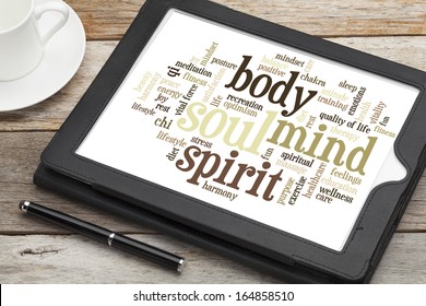 Mind, Body, Spirit And Soul - Word Cloud On A  Digital Tablet