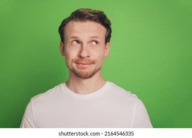 Minded Funny Blond Man Make Decision Look Empty Blank Space Isolated On Green Color Background