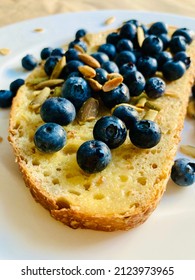 Mindful Food Choices Reward Us With Good Health. Try Toasted Cracked Wheat Sourdough Bread With Vegan Butter And Fresh Organic Blueberries Topped With Roasted Pumpkin Seeds For A Health Boost!