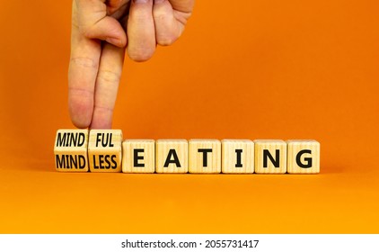 Mindful or mindless eating symbol. Doctor turns cubes and changes words mindless eating to mindful eating. Beautiful orange background, copy space. Medical and mindful or mindless eating concept. - Shutterstock ID 2055731417
