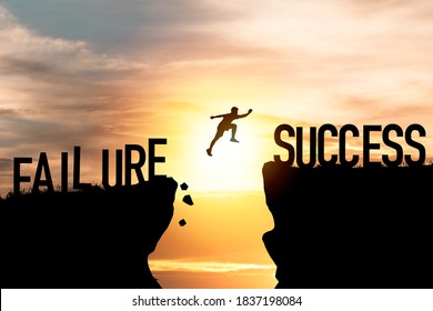 Mindset concept ,Silhouette man jumping from failure to success  wording on cliff with cloud sky and sunlight.