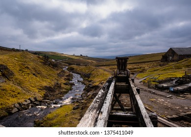 Mine Cart By A River In The North Pennines Area Of Outstanding Natural Beauty (AONB)