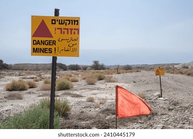 Minefields Sign with the text: Warning! Danger Mines in three languages on the south borders in Israel. 