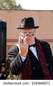 Minehead, Somerset, UK - 14th September 2019: A WW2 Re-enactor In Character As Winston Churchill At A 1940's Weekend  Giving The V For Victory Sign