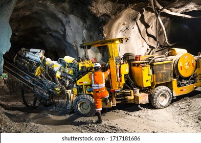 Miner climbing on a mineral mining machine