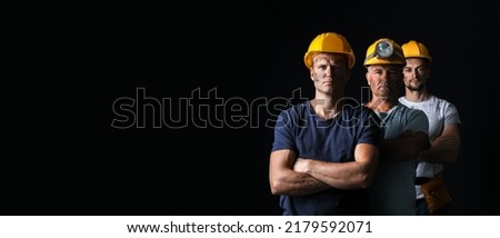 Miner men on black background with space for text