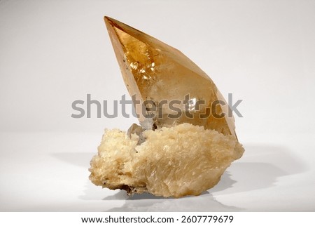Mineral Calcite, Very large translucent golden tipped calcite crystal perched on a matrix, Elmwood mine, Carthage, Smith Co., Tennessee, USA