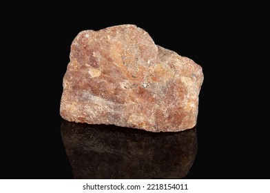 The Mineral Hessonite Is Reddish In Color With A Crystalline Structure. Isolated On Black Background.