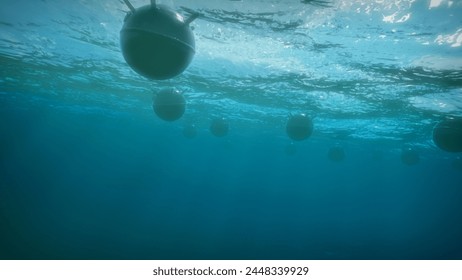 Mines float on the waves in the ocean