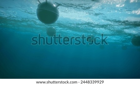 Mines float on the waves in the ocean