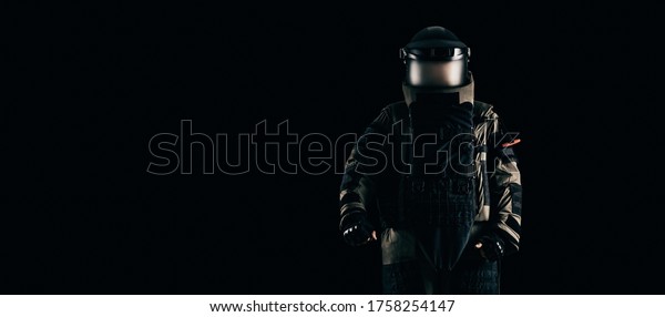 Minesweeper in an armored suit.\
The concept of anti-terrorism. Black background. Mixed\
media