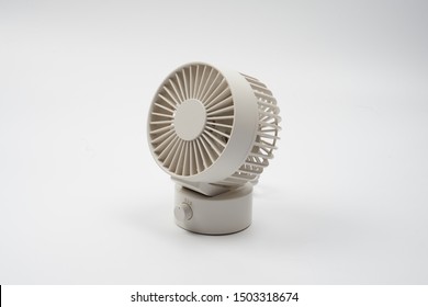 A Mini Air Fan Or Small Desk Fan On A White Background.    