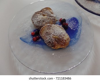 Mini Banana Pancakes On A Blue Serving Plate