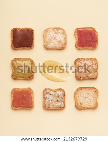 Mini bread toasts. Tasty toasted bread with honey on beige background. Pattern toasts.