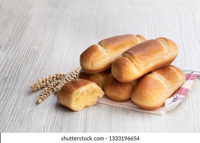 Mini  Brioche Bun In Paper Bag Isolated On White 