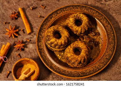 Mini bundt cakes with cinnamon, brown sugar in dark light from above - Powered by Shutterstock