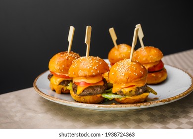 Mini Burgers And Fried Potatoes On The Plate