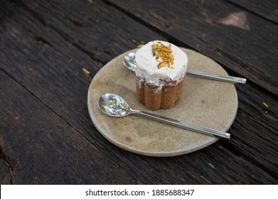 Mini Carrot Cake With White Cream In The Disk On The Wooden Table