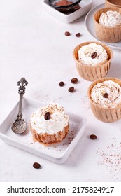 Mini Cheesecake With Cappuccino Taste Topped With Whipped Cream And Coffee Bean. Portion Size Dessert