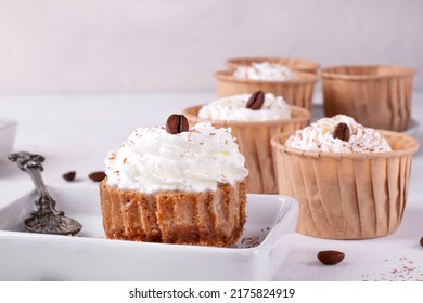 Mini Cheesecake With Cappuccino Taste Topped With Whipped Cream And Coffee Bean. Portion Size Dessert