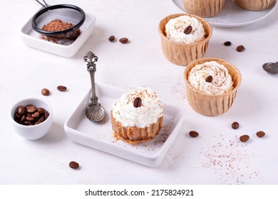 Mini Cheesecake With Cappuccino Taste Topped With Whipped Cream And Coffee Bean. Portion Size Dessert