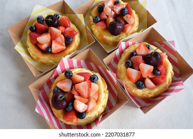 Mini Cheesecake With Strawberries, Blueberries And Cherry