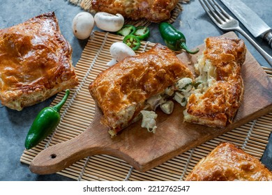 Mini chicken and mushroom puff pastry pies - Shutterstock ID 2212762547