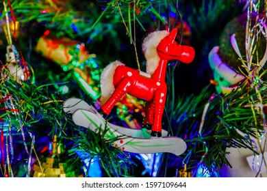 Mini Christmas Rocking Horse Hanging From Tree, Taken In KIngs Lynn, Norfolk, UK, On 23rd Dec 2019.