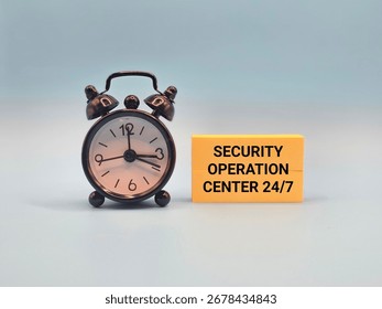 A mini clock and a note that says "SECURITY OPERATION CENTER 24 BY 7". This clear visual metaphor represents the continuous vigilance of an SOC in cybersecurity defense and risk management.