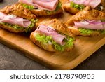 mini croissant with ham and cheese and red onion, canapes