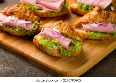 mini croissant with ham and cheese and red onion, canapes