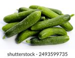 Mini cucumbers on white background.