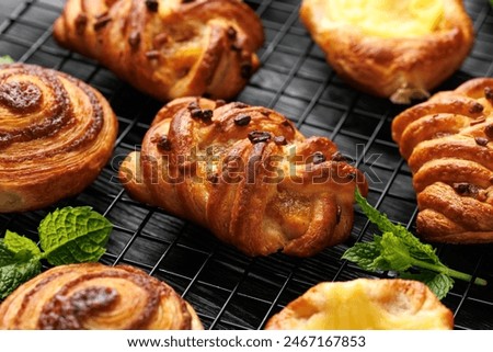 Mini danish pastry selection. Maple pecan plaits, cinnamon swirls and vanilla creme crowns