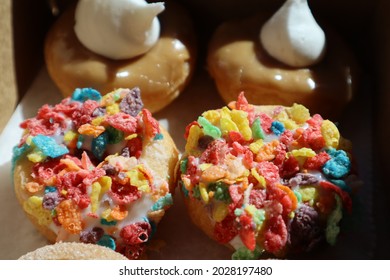 Mini Donuts in the Sun - Fruity Pebble and Maple Creme - Shutterstock ID 2028197480