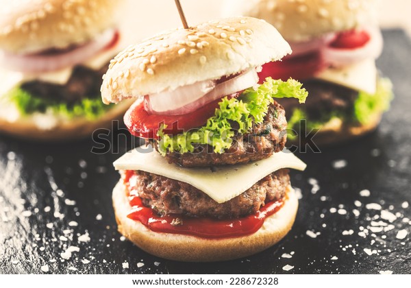 Mini double\
burgers appetizer, vintage look\
food.