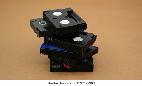 mini dv cassettes, mini dv tapes on a brown background