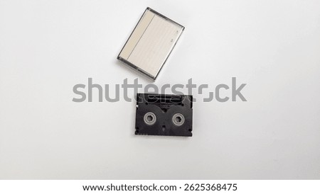 Mini DV Tape and Case on White Background for Video Recording