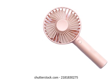 Mini electric pink fan with handle, isolated on white background. Concept : Portable electrical equipment that very useful when hot weather.                     
