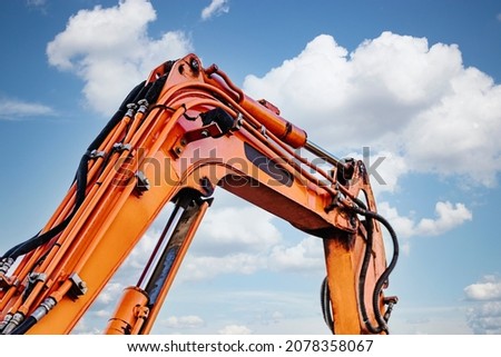 Mini excavator at the construction site. Compact construction equipment for earthworks