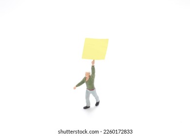 the mini figure hold the empty blank board - Shutterstock ID 2260172833