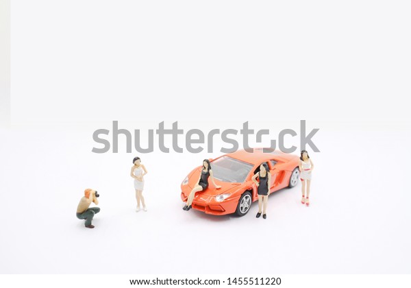 a Mini of\
figure photo the model with car.\
