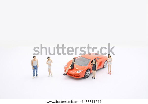a Mini of\
figure photo the model with car.\
