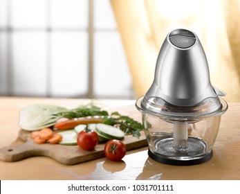 mini food processor and chopped vegetables on a wooden table. light comes from a window in the background