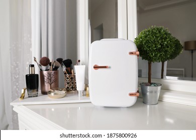 Mini Fridge For Cosmetic Products On White Vanity Table