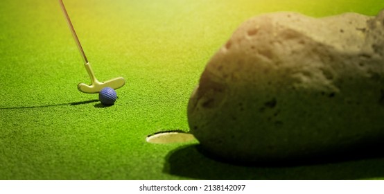 Mini Golf  - Putter Hit The Ball On Green Artificial Grass. Banner With Copy Space