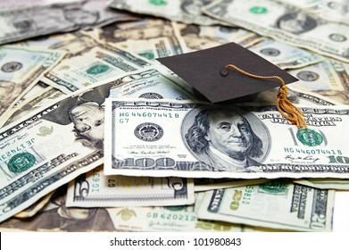 Mini Graduation Cap On US Money -- Education Costs