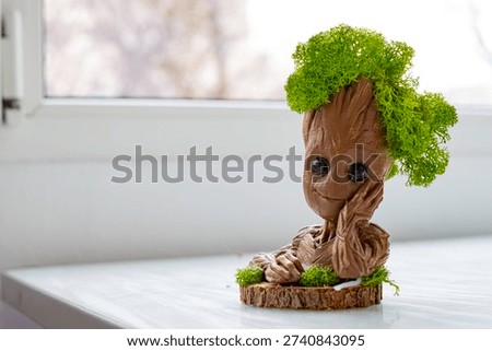 Mini Groot smiling in the sun