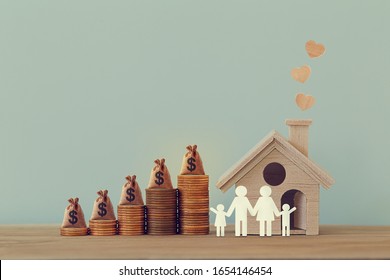 Mini house and heart, family members, US money bags on rows of rising coins on table. Family tax benefit, residential property tax concept: depicts home equity loan, real estate business investment. - Shutterstock ID 1654146454